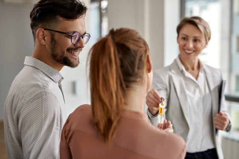 young happy couple buying new home